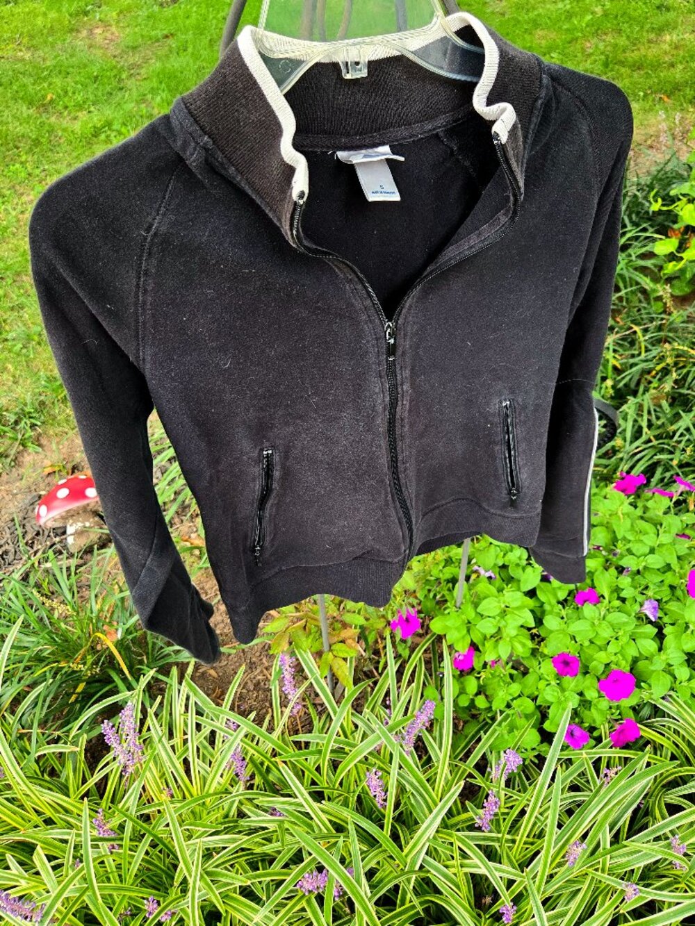 Black athletic sweater with two white pinstripes